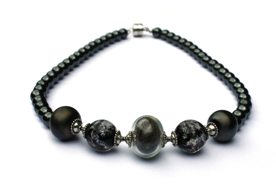 Ketting holle kraal as in glaskralen met Hematiet